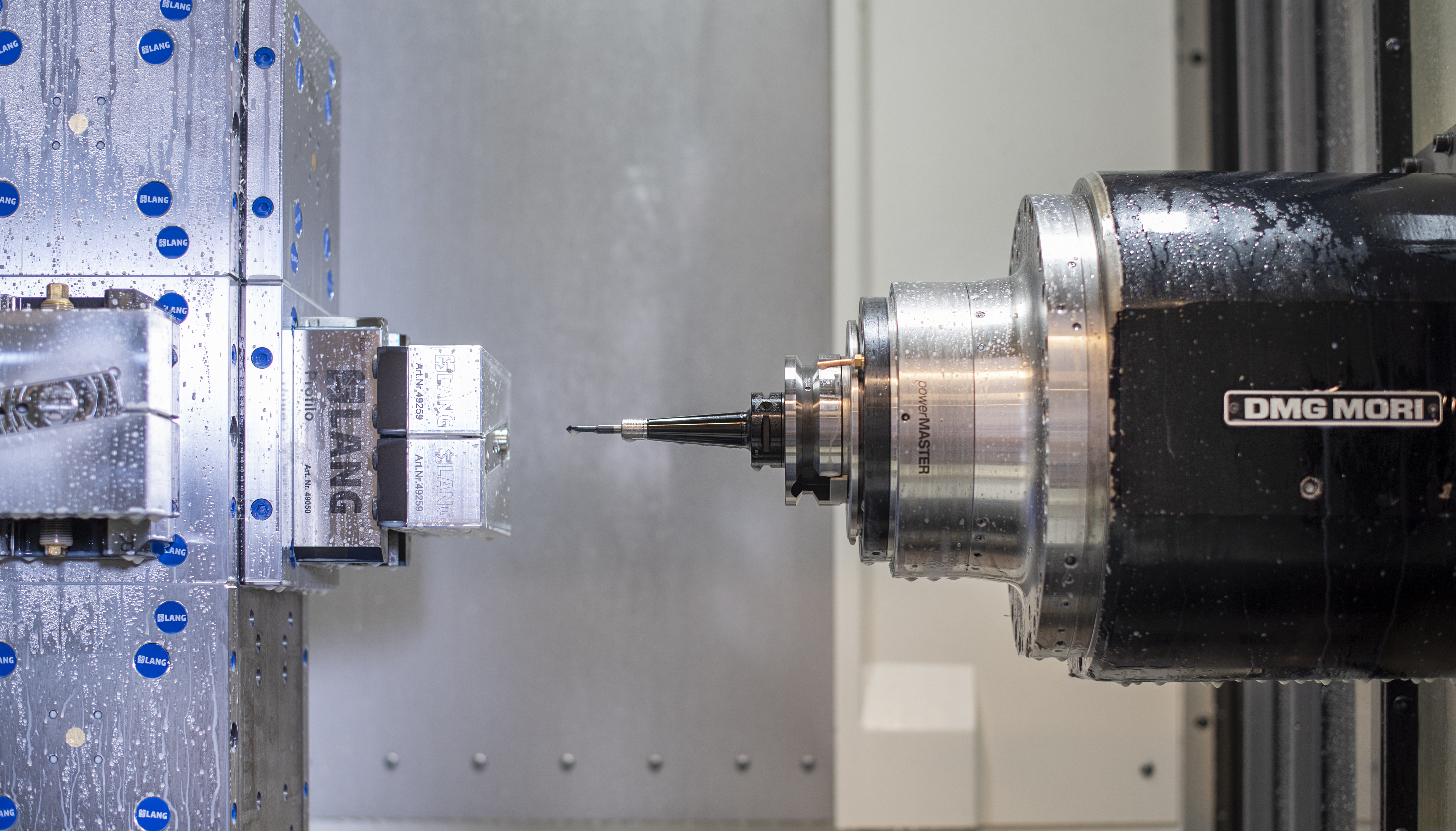 DMG MORI machining spindle facing a LANG workholding setup